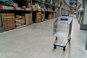 The warehouse full of goods, boxes and shelves photo