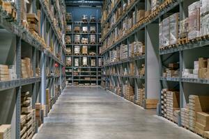 The warehouse full of goods, boxes and shelves photo