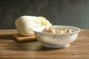 trotter soup with wooden background photo