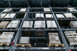 The warehouse full of goods, boxes and shelves photo