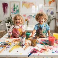 Cute children laughing together and having fun with paints. Painted in skin hands. Child portrait. Creative concept. Close up photo