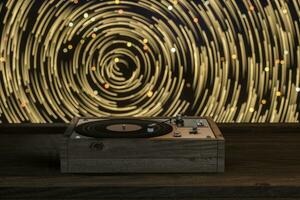 The old wooden vinyl record player on the table, 3d rendering. photo