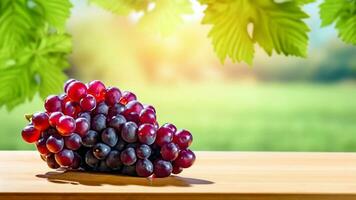 Wooden table with fresh red grapes and free space on nature blurred background, vineyard field. Generated AI. photo