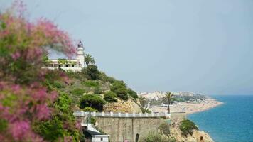 View of the lighthouse and the town, the coastline in the distance video