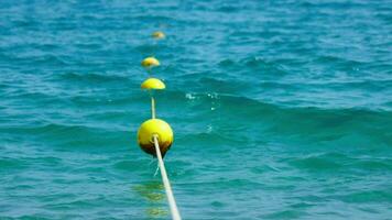 Yellow buoys on the beach, perspective view video