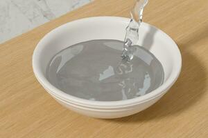 A bowl of water and splashing liquid, 3d rendering. photo