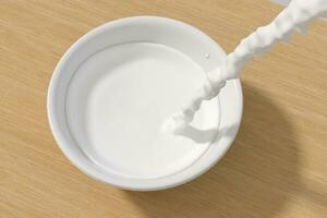 A bowl of milk and splashing liquid, 3d rendering. photo