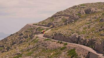 Mountain road with tourist buses video