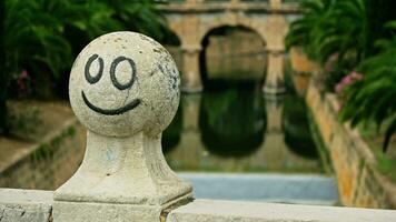 Drawing on the stone ball of the bridge railing video