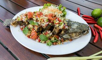 Fried Snakehead Fish in Spicy Herb Salad photo