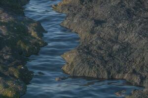 The river between the mountains in a sunny day, 3d rendering photo