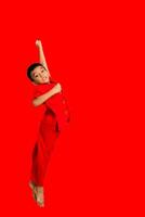 little boy fashion Smiling child in red chinese dress, style and fashion ideas for children. chinese new year photo