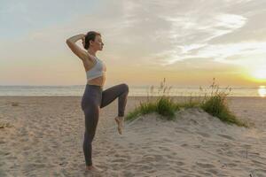 Meditation and harmony. A healthy lifestyle is mental health, the life of a modern person.  Does the asana pose workout outdoors. A female trainer uses fitness clothes for exercise. photo