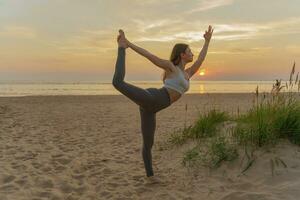 Meditation and harmony. A healthy lifestyle is mental health, the life of a modern person.  Does the asana pose workout outdoors. A female trainer uses fitness clothes for exercise. photo