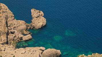 Beautiful rocky shore with clear blue water video