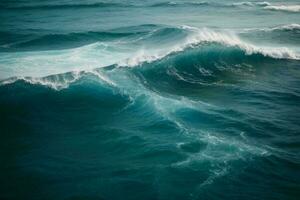 Aerial view to ocean waves. Blue water background photo