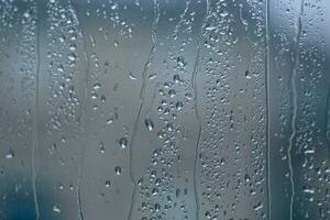 raindrops on the window in rainy days photo