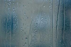 raindrops on the window in rainy days photo