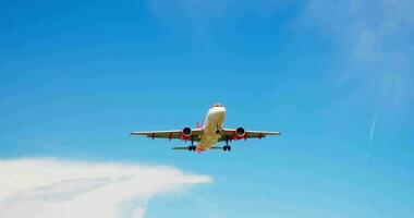 A commercial jet flying through a clear blue sky video