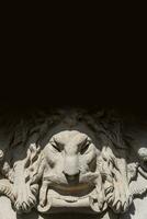 Dresden, Germany - Cover page with ancient decoration element of scary lion head with black background copy space photo