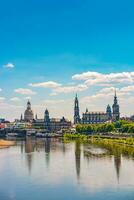 Dresden, Germany. Cover page with old city historical downtown, Elbe river at hot summer day at sunset photo