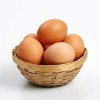 Fresh chicken eggs in woven bamboo basket are isolated on white background with clipping path. Close up with full focus photo