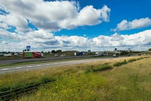 High Angle View of British Motorways and Highways and Traffic on M1 Junction 11a of Luton and Dunstable England UK. Image Was Captured on August 15th, 2023 photo