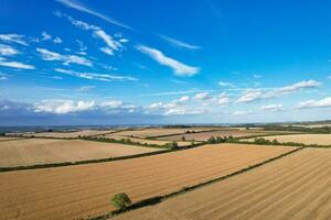 High Angle Footage of British Agricultural Farms at Countryside Landscape Nearby Luton City of England Great Britain of UK. Footage Was Captured with Drone's Camera on August 19th, 2023 photo