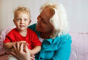 Happy grandmother with her little grandson. photo