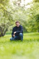 Middle-aged man resting in the city park photo