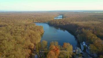 Aerial view of the Etangs de Commelles surrounded by the forest video