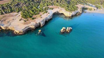 Aerial view of two sisters, Le due sorelle, at the beach in Apulia, South Italy video