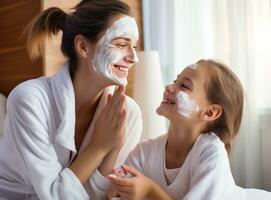 A woman and daughter doing face cream photo