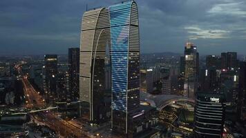 Aerial of CBD buildings by Jinji Lake at night in Suzhou, China. video