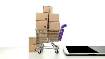 Paper boxes in the trolley and smartphone. Online shopping and e-commerce concept. photo