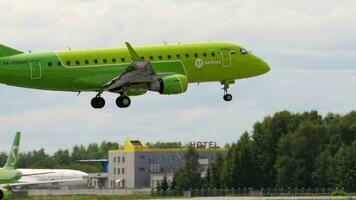 NOVOSIBIRSK, RUSSIAN FEDERATION JULY 15, 2022 - Embraer E170 of S7 Airlines landing, slow motion. Footage of a passenger jet plane arriving, side view video