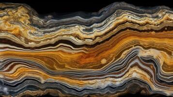 A beautiful pattern on the surface of a slab of black marble with yellow and white veins photo