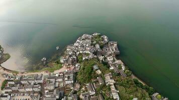 Village and lake in Shuanglang, Yunnan, China. video