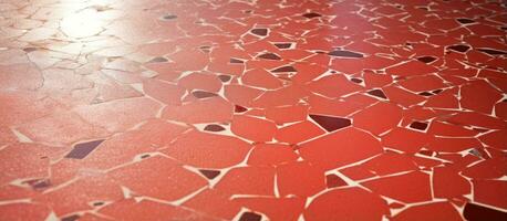Many scratches are on the old red terrazzo floor photo