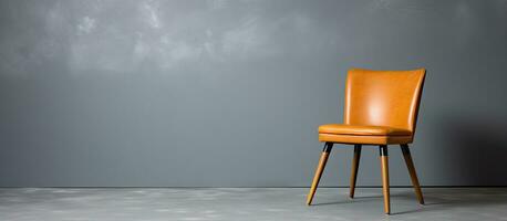 Brown chair alone on a grey backdrop photo