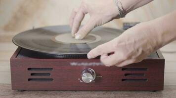 Turning on and playing a Retro vinyl record playing spining. video