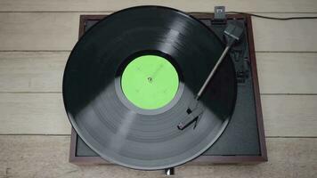 To view of a Vinyl Record Spinning with green screen croma on vinyl cover. video