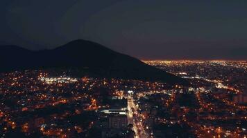 Aerial drone flying over night Salta city in Argetntina. Sunset. City night lights. video