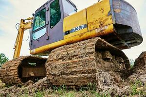 Excavator on construction site photo