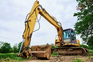 Excavator on construction site photo