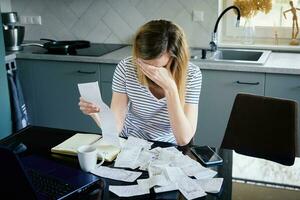 Woman calculating payment bill at home photo