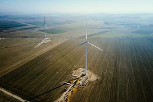 Construction site near windmill turbine, Wind generator installing photo