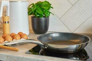Induction hob with frying pan, Kitchen appliance photo