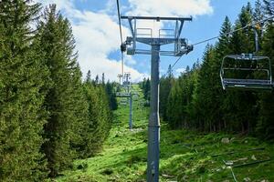 Mountains with open cable cars lift, Karpacz, Poland photo