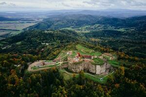 Srebrna Gora fortress and Sudety mountains at autumn season, aerial drone view photo